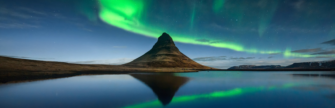 Northern Lights behind the mountain Kirkjufell in west Iceland.