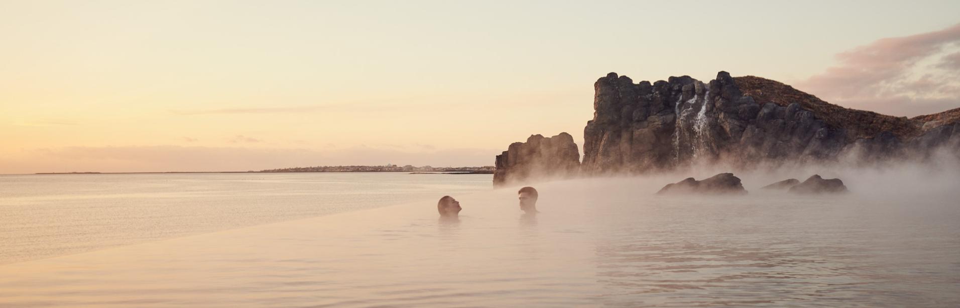 Couple bathing in Sky Lagoon in Iceland.