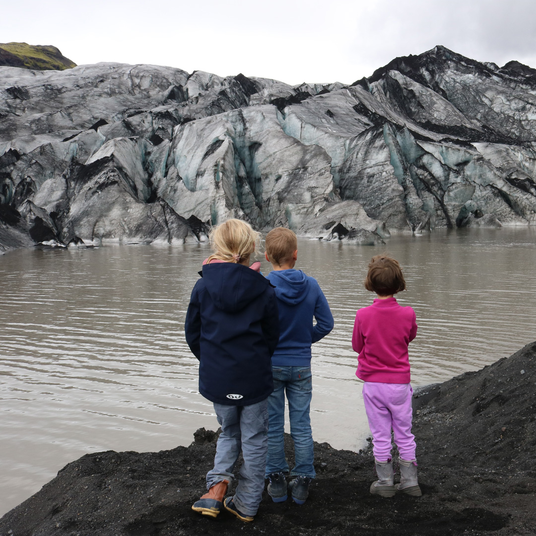 Children looking at a glacier in Iceland.