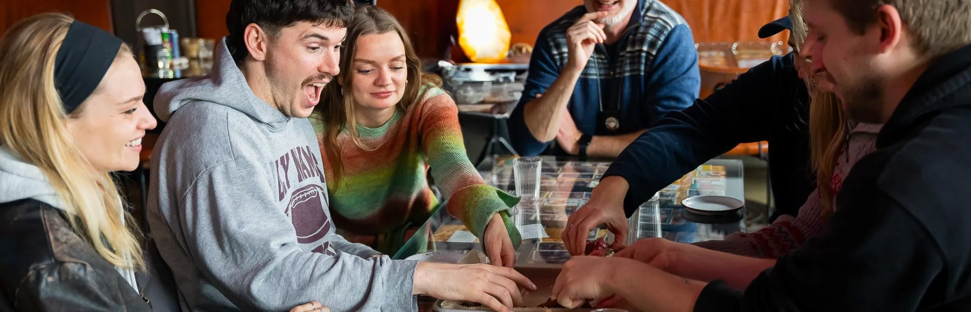 Guests sharing food around a table in Reykjavík.