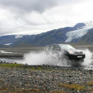 Self drive tour icelandic highlands: river crossing by 4x4 wheel car, highlands of Iceland.