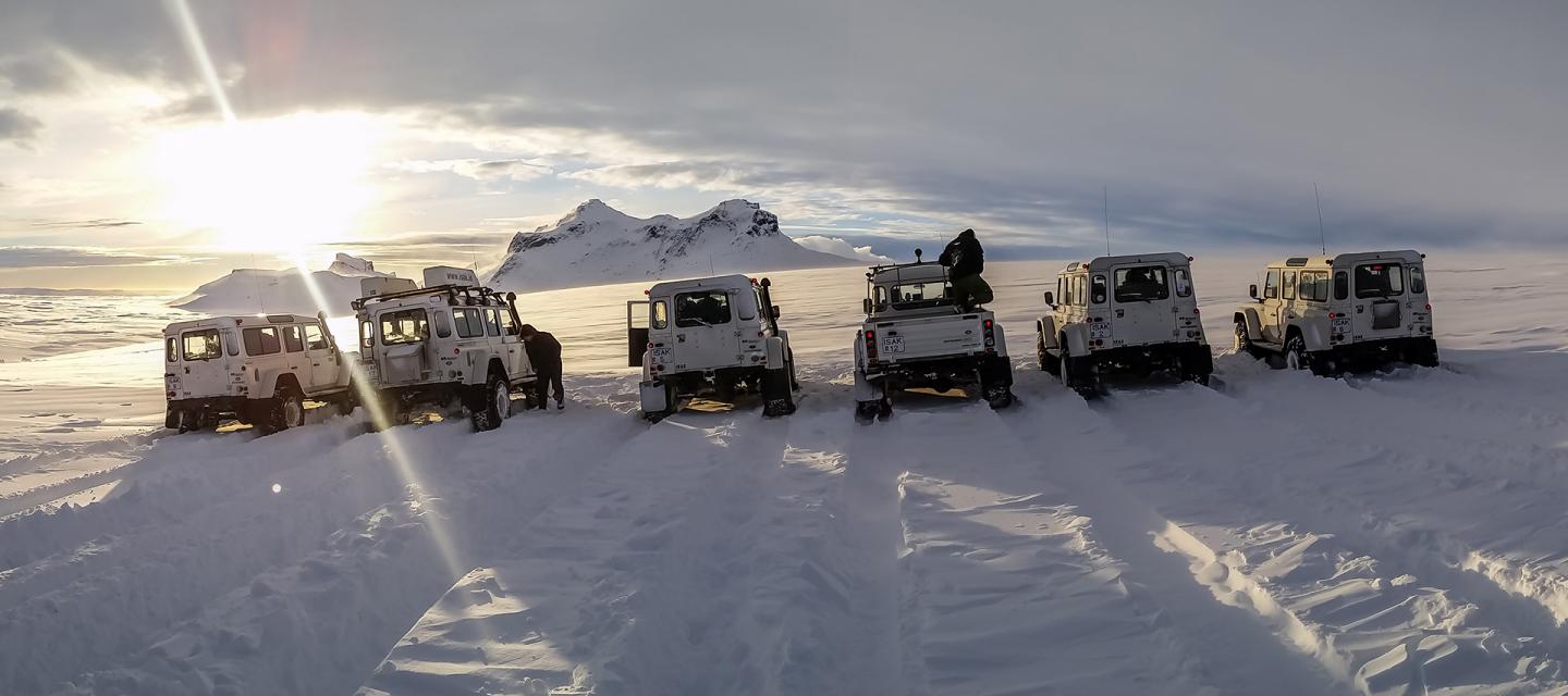 Group trip in Iceland: Superjeeps in a snowy winter landscape in Iceland.